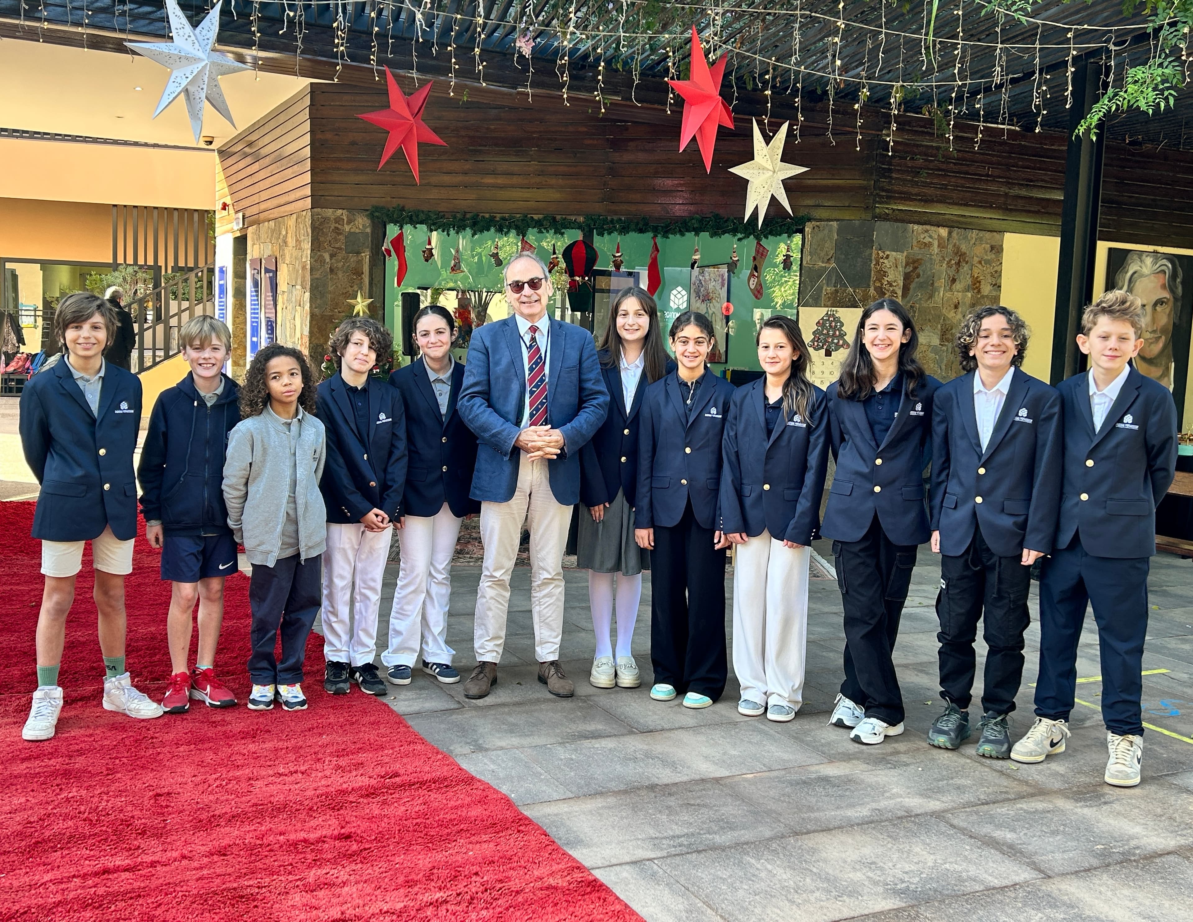 Planète Montessori students posing with an adult on campus
